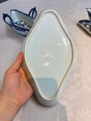 A pair of Chinese blue and white handled sauce boats and stands with pagodas along a river — photo 10