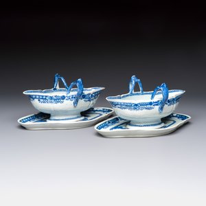 A pair of Chinese blue and white handled sauce boats and stands with pagodas along a river — photo 1
