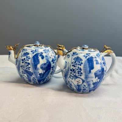 A pair of Chinese blue and white lotus-shaped teapots with mounts — photo 1