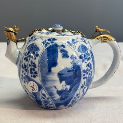 A pair of Chinese blue and white lotus-shaped teapots with mounts — photo 2