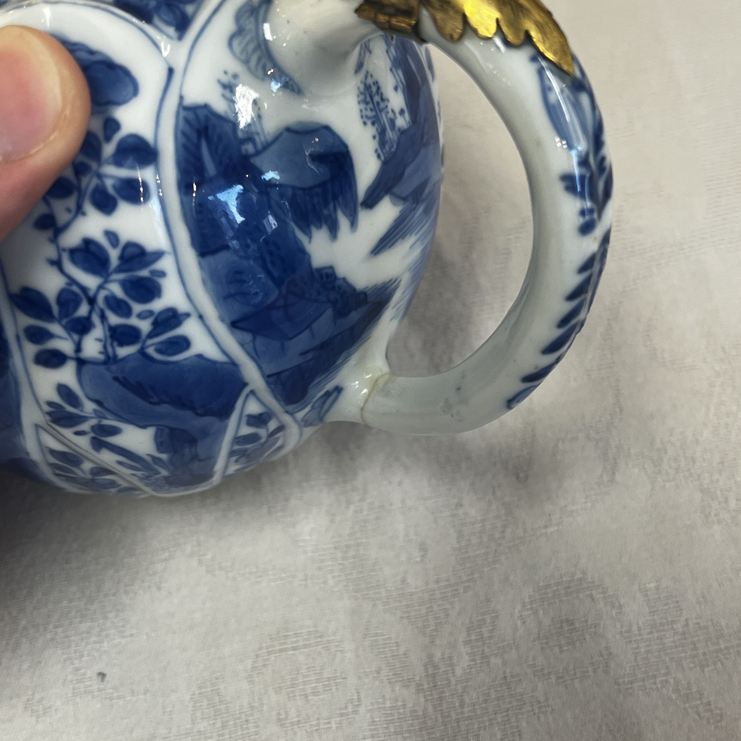 A pair of Chinese blue and white lotus-shaped teapots with mounts — photo 31
