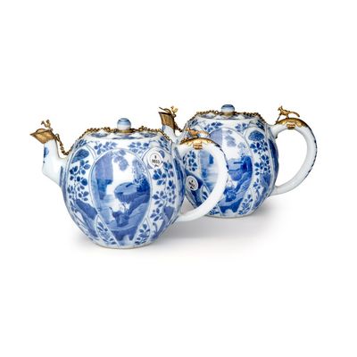 A pair of Chinese blue and white lotus-shaped teapots with mounts, Kangxi