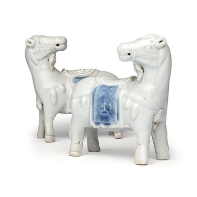 A pair of Chinese blue and white models of horses, Qianlong