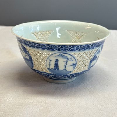 A pair of Chinese blue and white reticulated 'Linglong' bowls with landscape panels — photo 25