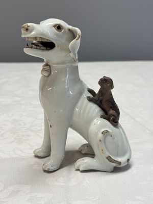 A pair of Chinese export white-glazed and biscuit models of hounds with pups — photo 12