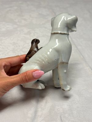 A pair of Chinese export white-glazed and biscuit models of hounds with pups — photo 15
