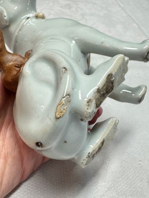 A pair of Chinese export white-glazed and biscuit models of hounds with pups — photo 10