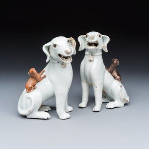 A pair of Chinese export white-glazed and biscuit models of hounds with pups — photo 1
