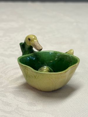 A pair of Chinese famille verte sancai biscuit duck-and-lotus-form water droppers on later wooden stands — photo 19