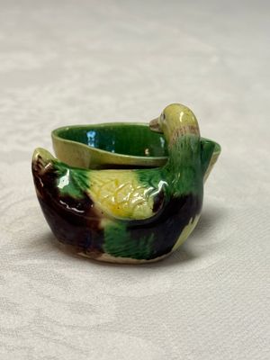 A pair of Chinese famille verte sancai biscuit duck-and-lotus-form water droppers on later wooden stands — photo 21