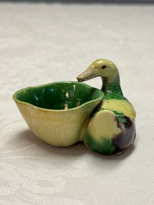 A pair of Chinese famille verte sancai biscuit duck-and-lotus-form water droppers on later wooden stands — photo 22