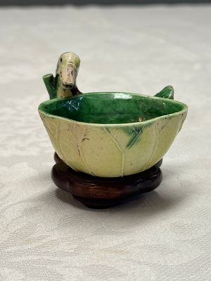 A pair of Chinese famille verte sancai biscuit duck-and-lotus-form water droppers on later wooden stands — photo 23