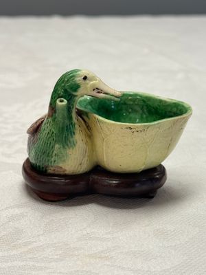 A pair of Chinese famille verte sancai biscuit duck-and-lotus-form water droppers on later wooden stands — photo 24