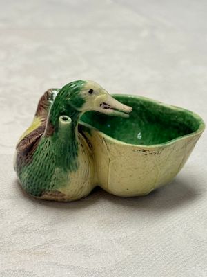 A pair of Chinese famille verte sancai biscuit duck-and-lotus-form water droppers on later wooden stands — photo 35