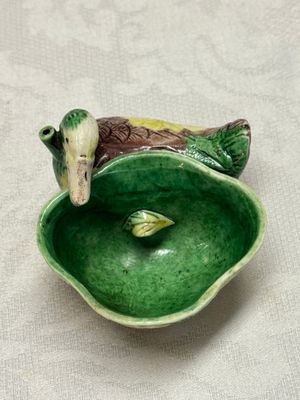 A pair of Chinese famille verte sancai biscuit duck-and-lotus-form water droppers on later wooden stands — photo 36
