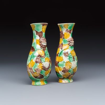 A pair of Chinese famille verte sancai biscuit wall pocket vases, Kangxi