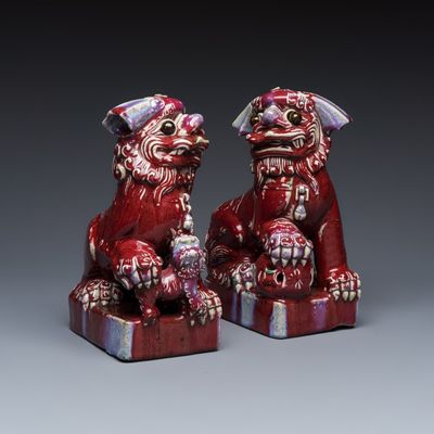 A pair of Chinese flambé-glazed models of Buddhist lions, 19th C.