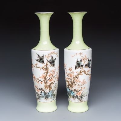 A pair of Chinese polychrome semi-eggshell 'birds among blossoming plum branches' vases, dated 1972