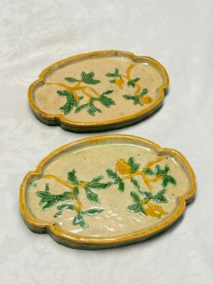 A pair of Chinese sancai-glazed stoneware quadrilobed trays with fruiting branches — photo 1
