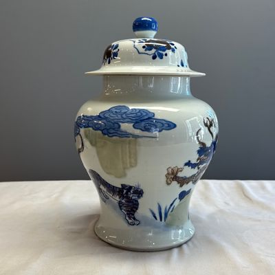 A pair of Chinese underglaze-blue, copper-red and celadon-glazed 'Dragon and Tiger' vases and covers — photo 31