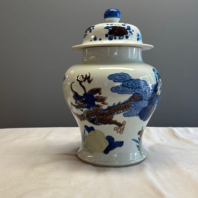 A pair of Chinese underglaze-blue, copper-red and celadon-glazed 'Dragon and Tiger' vases and covers — photo 32