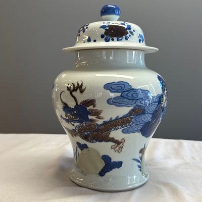 A pair of Chinese underglaze-blue, copper-red and celadon-glazed 'Dragon and Tiger' vases and covers — photo 33