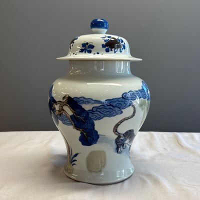 A pair of Chinese underglaze-blue, copper-red and celadon-glazed 'Dragon and Tiger' vases and covers — photo 35