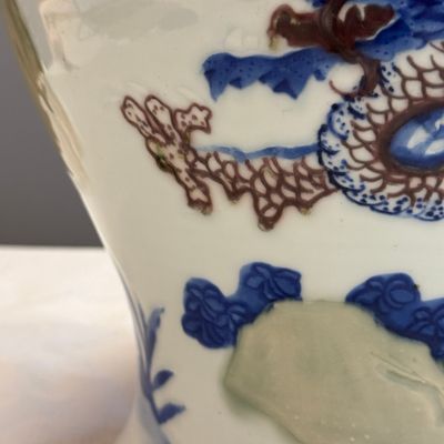 A pair of Chinese underglaze-blue, copper-red and celadon-glazed 'Dragon and Tiger' vases and covers — photo 7
