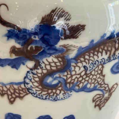 A pair of Chinese underglaze-blue, copper-red and celadon-glazed 'Dragon and Tiger' vases and covers — photo 8