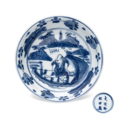A small Chinese blue and white 'Fisherman' footed saucer dish, Chenghua mark, Wanli