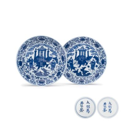 An extremely rare pair of Chinese blue and white 'Foreigners Presenting Treasures' plates, Wanli mark and of the period