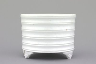 A blanc de Chine cylindrical censer on four feet, 19th C.