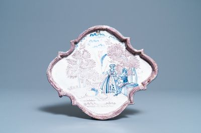 A blue and manganese Dutch Delft 'pastoral scene' plaque, 18th C.