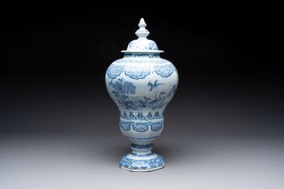 A blue and white Dutch Delft baluster vase and cover with birds among flowering branches, late 17th C.