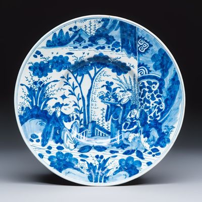 A blue and white Dutch Delft chinoiserie dish with figural design, early 18th C.