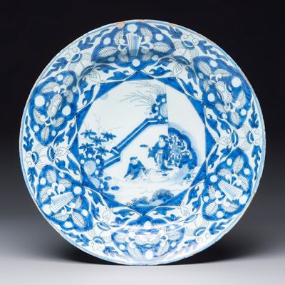 A blue and white Dutch Delft chinoiserie dish with figural design, early 18th C.