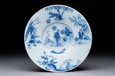 A blue and white Dutch Delft chinoiserie plate, 17th C.