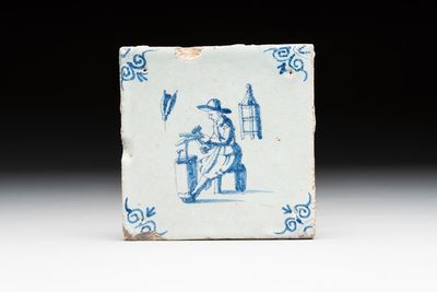 A blue and white Dutch Delft 'coppersmith' tile, 17th C.