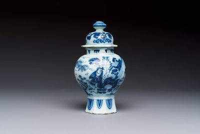 A blue and white Dutch Delft covered vase and two polychrome plates, 17/18th C.