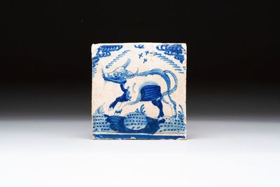 A blue and white Dutch Delft 'crown' 'ox' tile, Rotterdam, early 17th C.