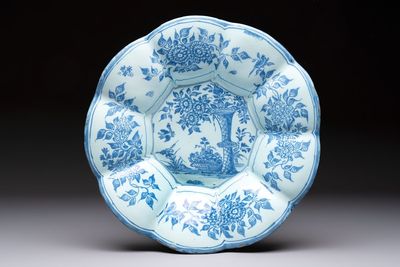 A blue and white Dutch Delft dish with a Chinese 'Gu' vase and a flower basket, 17th C.