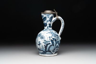 A blue and white Dutch Delft ewer with a mounted pewter lid, 17th C.