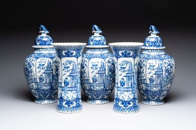 A blue and white Dutch Delft garniture of five vases and covers, 19th C.