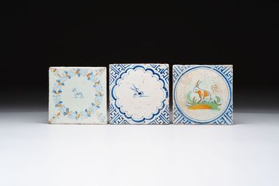 A blue and white Dutch Delft 'stag' tile and two polychrome 'goat' and 'rabbit' tiles, 17th C.