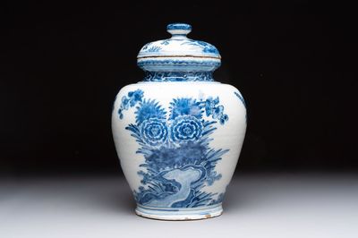 A blue and white Dutch Delft vase and cover with floral design, early 18th C.