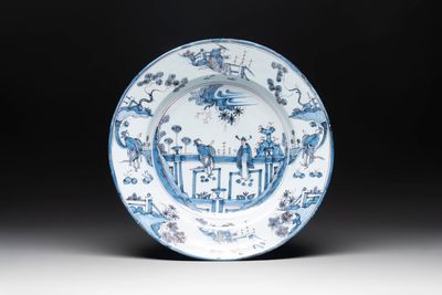 A blue and white 'figures in a garden' chinoiserie dish, Frankfurt, 17th C.