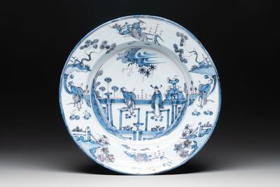 A blue and white 'figures in a garden' chinoiserie dish, Frankfurt, 17th C.