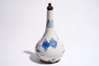 A blue and white Islamic vase with a silver lid, prob. iran, 17/18th C.