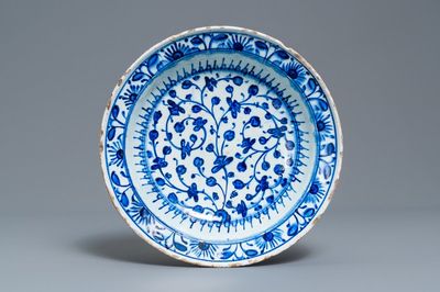 A blue and wite Iznik dish with floral design, Turkey, late 16th C.