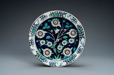 A blue-ground Iznik-style pottery dish, Kütahya, Turkey, 19th C.